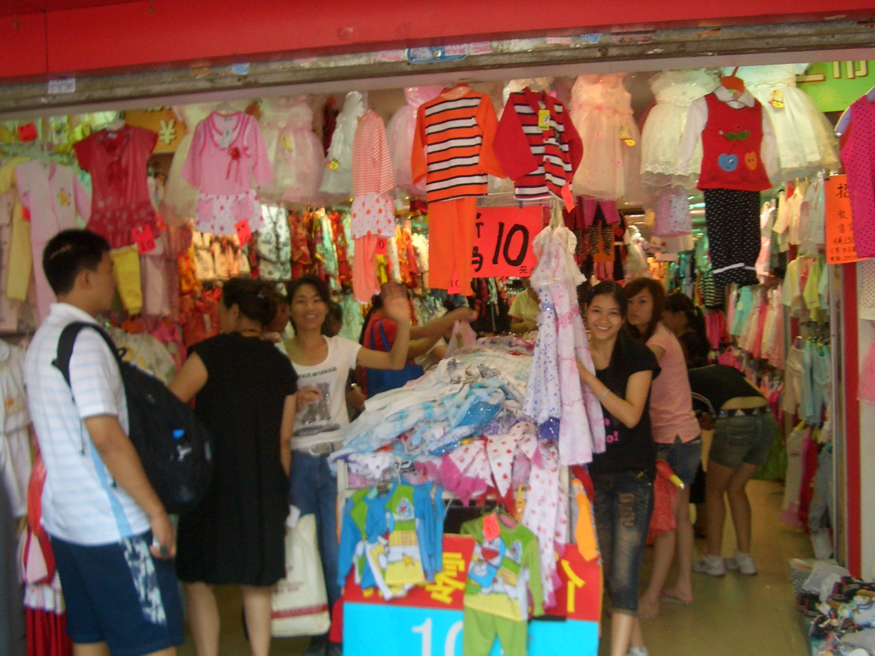 Guangzhou-clothing-shop-0541 - a store with a lot of clothes and people
